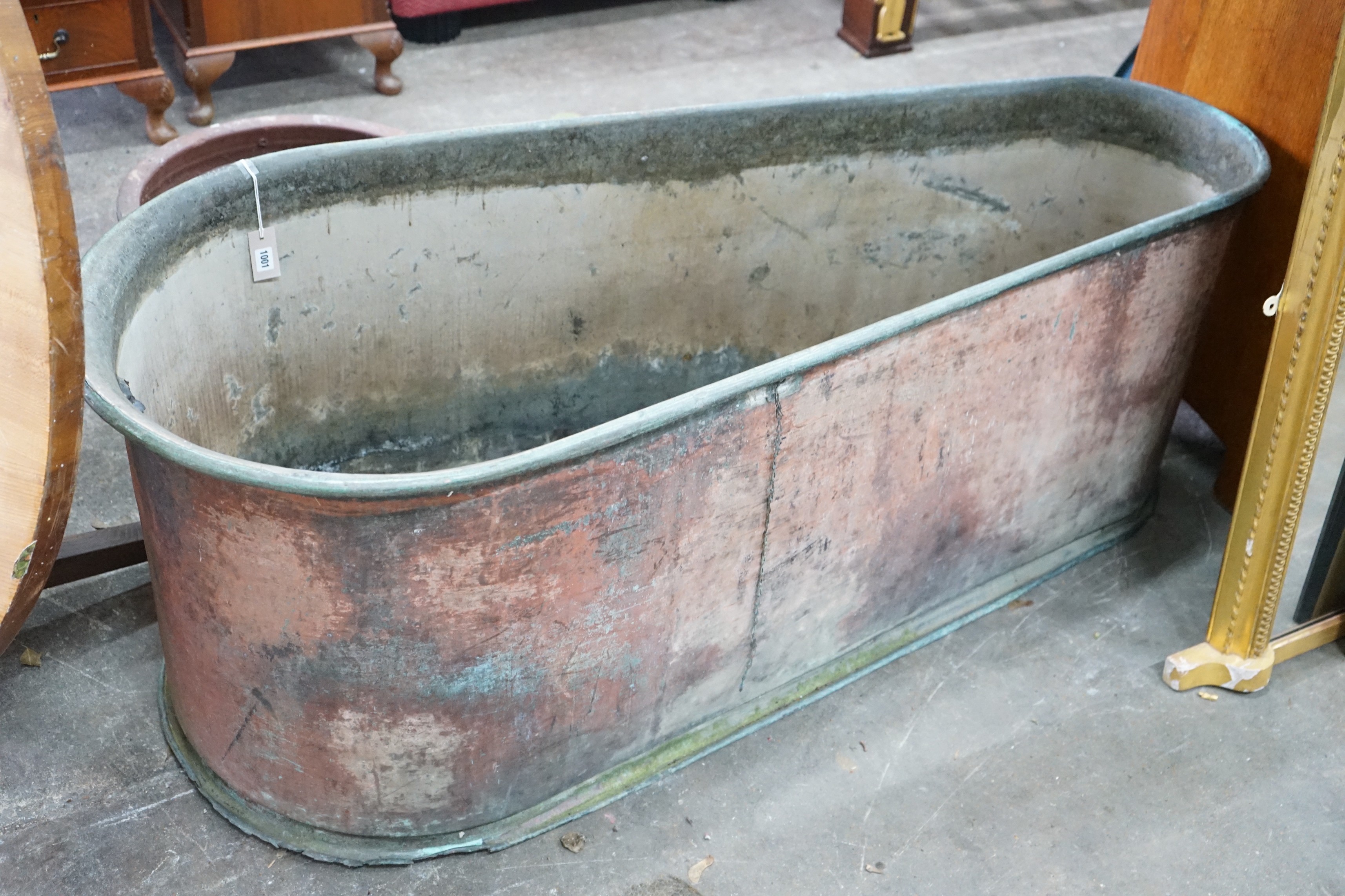 A 19th century copper bath of tapering form, length 162cm, depth 68cm, height 63cm